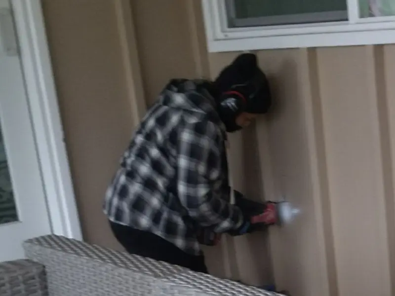Professional electrician installing an exterior outlet in Arnold